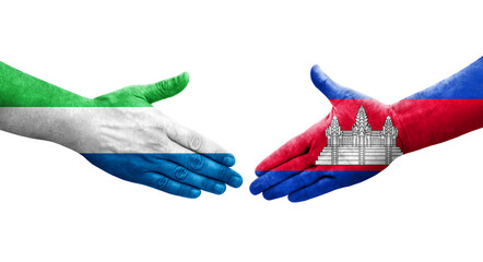 Handshake between Cambodia and Sierra Leone flags painted on hands, isolated transparent image.