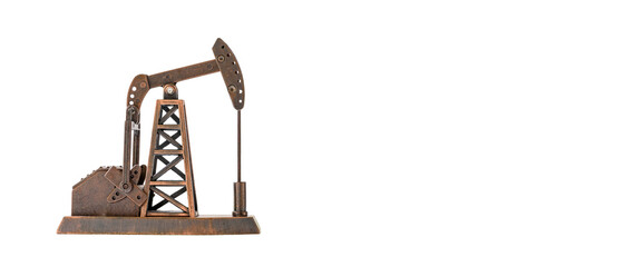 Petroleum industry, petrodollar and crude oil concept : Pumpjack and isolated on white background. Pumpjacks are common in oil-rich areas and are used to produce or extract oil from onshore wells.