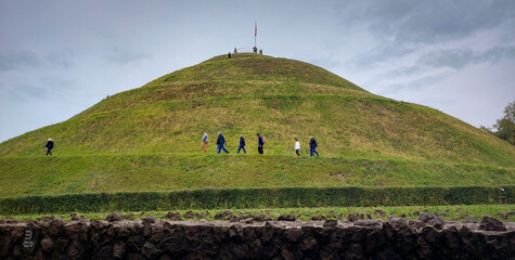 Piłsudski Mound landscape with walking people 