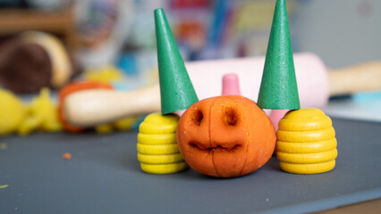 jack o lantern or the symbol of spooky halloween made from clay and blocks arranged that looks like devil with two horns