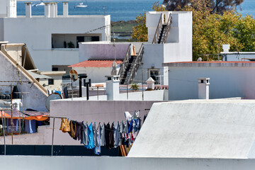 Fototapeta na wymiar laundry and chimney and terrace in Olhao, Algarve, Portugal
