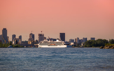 Obraz premium A luxury cruise ship docks in port at sunset. Passenger vessel Sea traveling