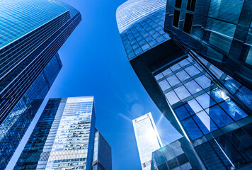 Obraz na płótnie Canvas Skyscrapers low angle view. Skyscrapers looking up perspective, sky in the background, Moscow, Russia.