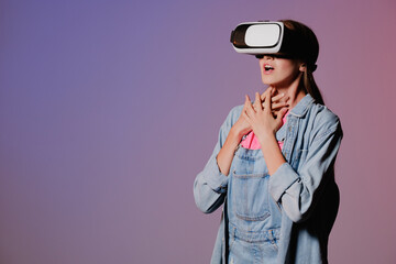 VR virtual reality glasses on a girl. Looks to the future. Touching the new. Fantastic virtual...