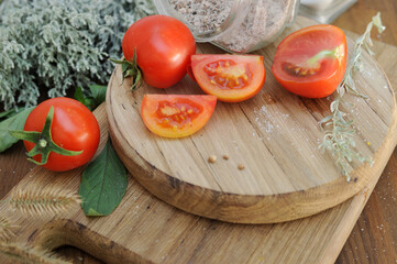 Ripe organic tomatoes on an authentic wooden table