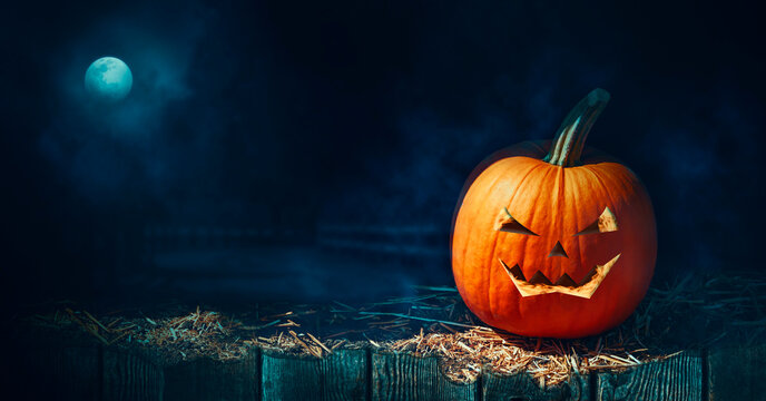 halloween pumpkin on a fence