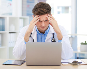 Stress, anxiety or burnout for doctor with laptop working on medicine, medical or healthcare...