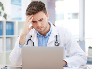 Doctor, computer working and work headache of a man healthcare worker struggling with tech. Medical...