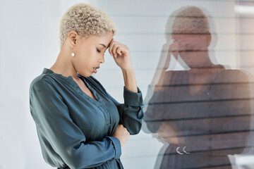 Black woman, stress and work with mental health, tired and anxiety by window depressed in office. Professional, career and sad girl frustrated with headache, burnout and depression at job in New York - obrazy, fototapety, plakaty