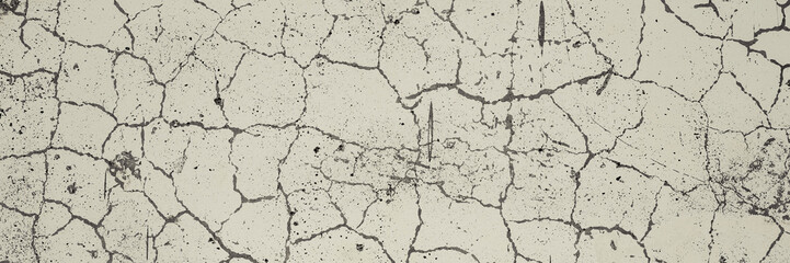 Cracked concrete wall texture. Weathered rough surface. Gray and white color. Panoramic background for grunge design.