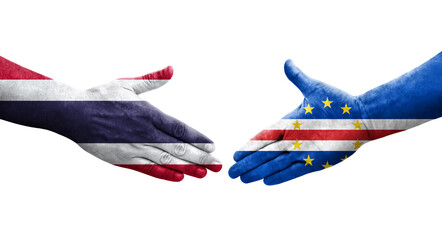 Handshake between Cape Verde and Thailand flags painted on hands, isolated transparent image.