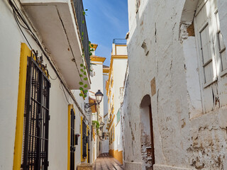 Charming and typical pedestrian alley with whitewashed houses in Marbella Old Town. Province of Malaga, Costa del Sol, Andalusia, Spain