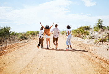 Freedom, desert and friends walking outdoor in nature on a road trip vacation in the countryside....