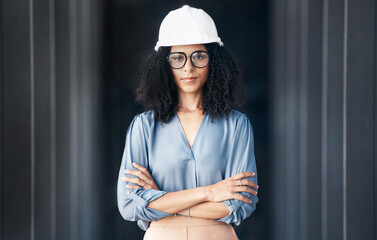 Architecture, engineering and black woman leader portrait at construction site, industrial building or property development. Pride, vision and motivation of female contractor manager in safety helmet