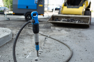 Asphalt Road repairing works with jackhammer.