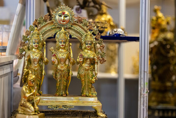Hindu lord Ram and family brass idol on display. Selective focus on face.