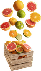 Oranges and tangerines falling on a wooden box