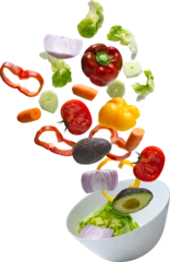 Foto op Plexiglas vegetables falling into bowl © Miquel
