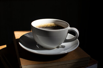 A coffee cup on a dark wooden background