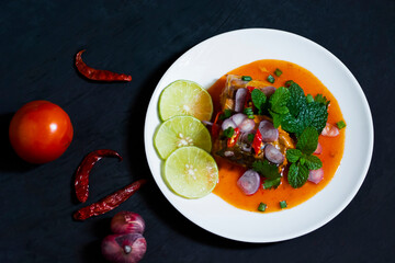 Salad of canned fish on dark background