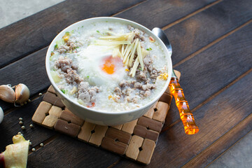 Porridge in a cup on the wooden floor