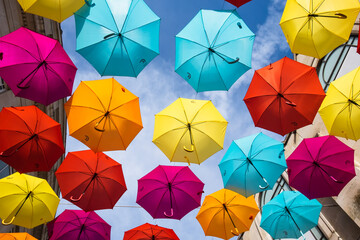 Fototapeta na wymiar Suspended umbrellas inside a London building 