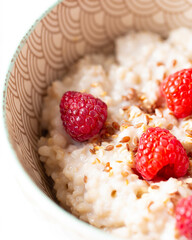 morning oatmeal with sesame and raspberries