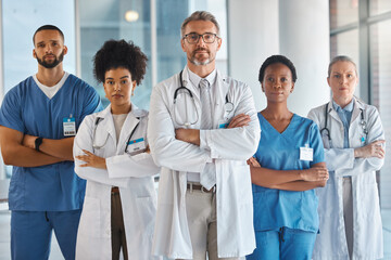 Doctors, nurses and team portrait in hospital, clinic or medical office. Diversity, health and healthcare professionals standing together arms crossed in confidence teamwork, collaboration or support