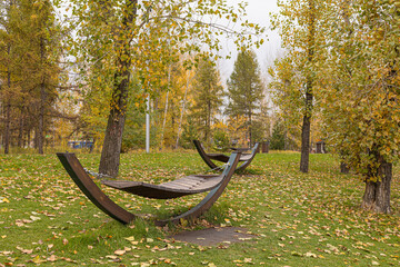 Rocking beds for rest in the public park. Outdoor beds on the lawn