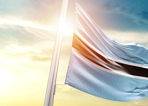 Botswana national flag cloth fabric waving on the beautiful sunlight - Image