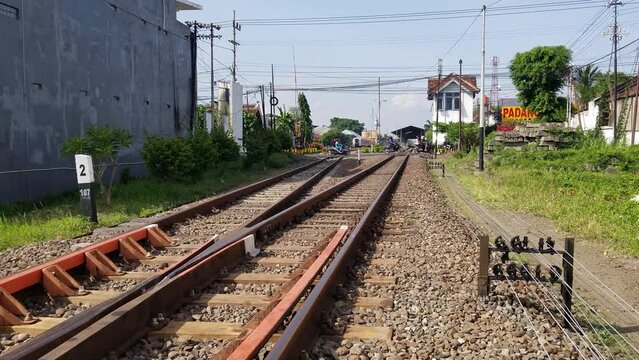 People crossing two railroad tracks