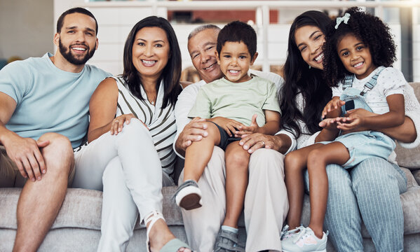 Family, Sofa And Happy In Living Room In Portrait Together In Home Or On Vacation. Children, Parents And Grandparents Love, Happiness And Smile While On Holiday, In Hotel Or House In Houston, Texas