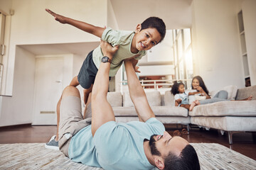 Happy family, father and son playing on a living room floor, relax and cheerful while bonding in...