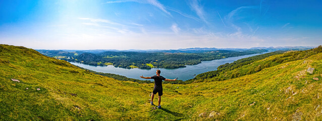 Aerial view of a man on the hike in Windermere in Lake District, a region and national park in...