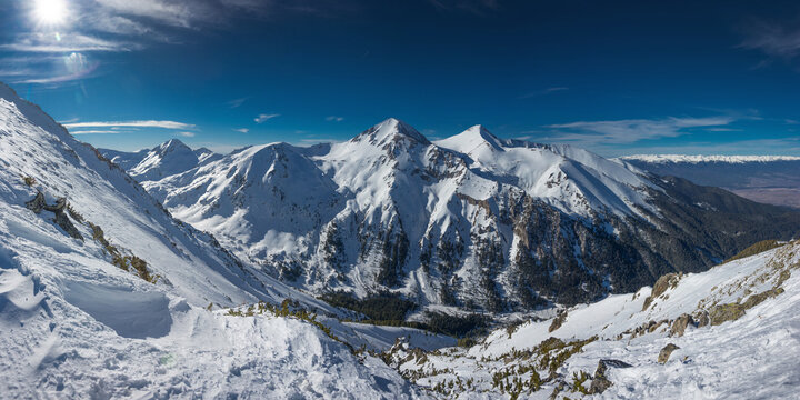 Panoramic landscape of Vihren and Kutelo peaks in sunny winter day. Observation deck at Todorka peak in the Pirin Mountains near Bansko, Bulgaria.