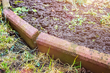 Fototapeta premium Broken road border sidewalk. Construction curb