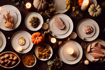 An idea for a beautiful fall setting for a family Halloween dinner. Sweets and pastries on the table. Orange pumpkin as decoration. Cozy autumn home atmosphere.