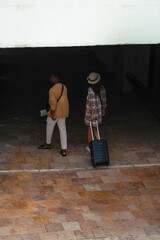 Two tourists going in subway station