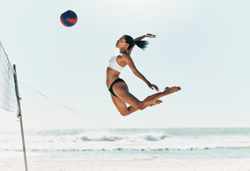 Sports woman jump at volleyball beach summer outdoor competition game on ocean or sea sand playing...