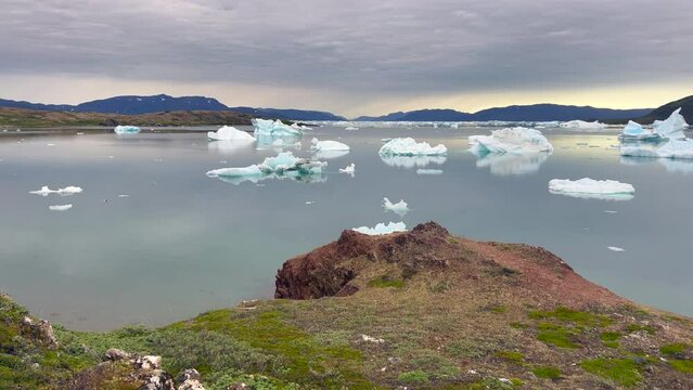 Panoramic view of the fjords of Narsaq, Greenland, with drifting icebergs from the nearby glaciers. Narsaq, Southern Greenland