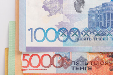 Kazakhstan money - tenge. 500, 1000, 2000, 5000, 10000 banknotes. Close up of tenge on white background.
