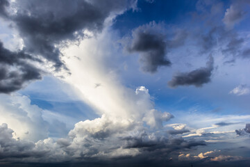 The dark sky with heavy clouds converging and a violent storm before the rain.Bad or moody weather...