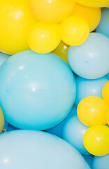 Abstract background similar to the Ukrainian flag. Blue and yellow balloons.