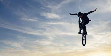 Mountain bike man, sky jump and energy of action, freedom and competition silhouette, shadow and mockup. Professional cycling athlete in air, danger performance and bicycle risk on background clouds