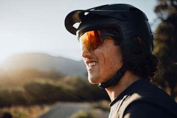 Mountain biking, glasses and helmet for man on adventure in nature for sports in summer. Face of a...