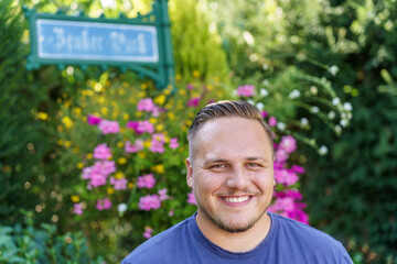Friendly smiling young man with mustache and beard