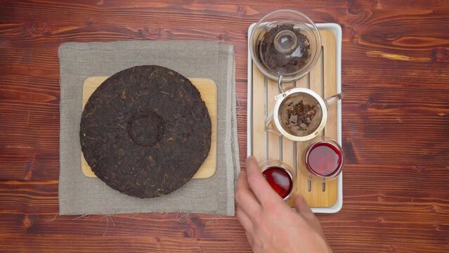 Shu Pu erh cake in English chinese fermented black tea. Healthy invigorating drink coffee substitute. Top view