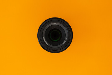 Camera lens on the orange background