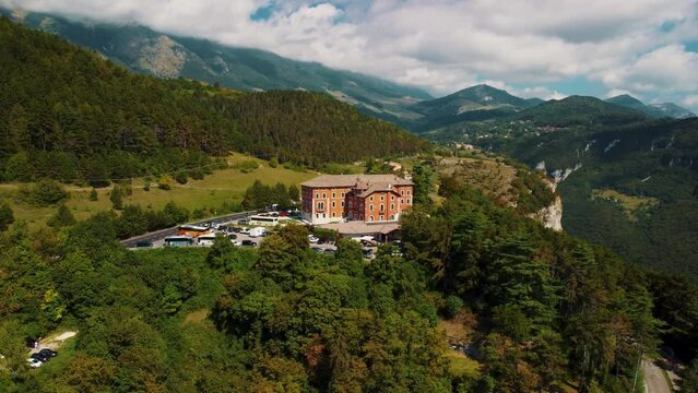 Hotel Stella Alpina in alps, Italy, surrounded by mountains.