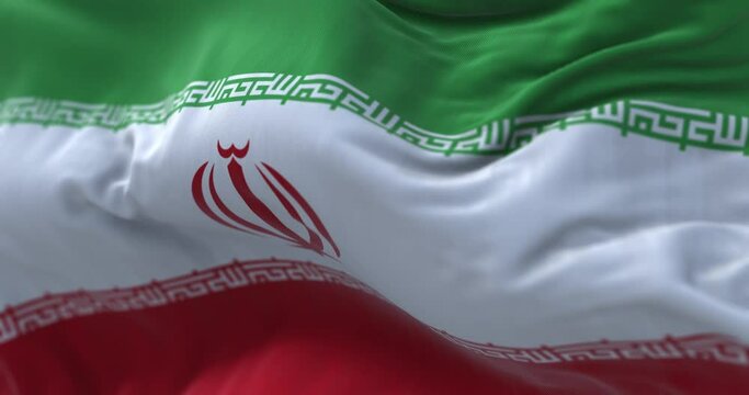 Close-up view of the Iran national flag waving in the wind